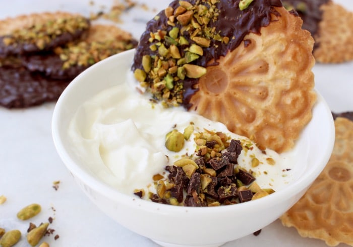 White Bowl of Whipped Cannoli Filling or Dip with Chocolate Pistachio Pizzelle White Bowl of Whipped Cannoli Filling or Dip with Chocolate Pistachio Pizzelle