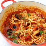 Red Bowl of Spaghetti in Puttanesca Sauce