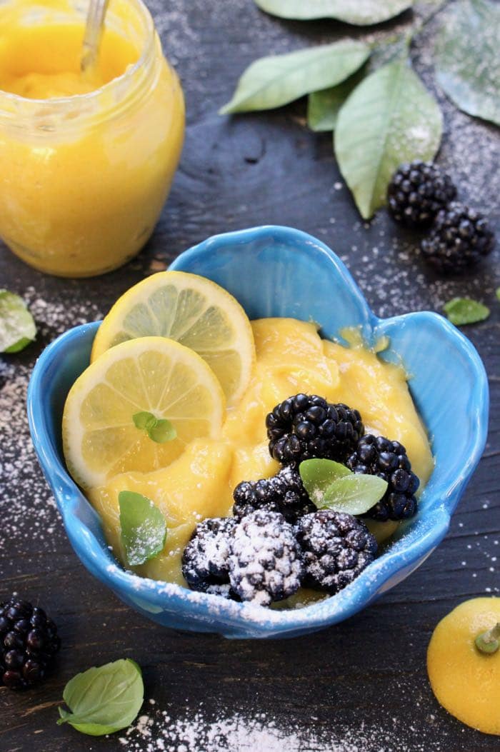 Blue Bowl of Lemon Curd with Blackberries, Basil and Powdered Sugar