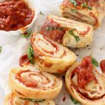 Slices of stromboli filled with melting cheese and cold cuts