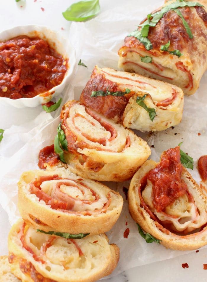 Slices of stromboli filled with melting cheese and cold cuts