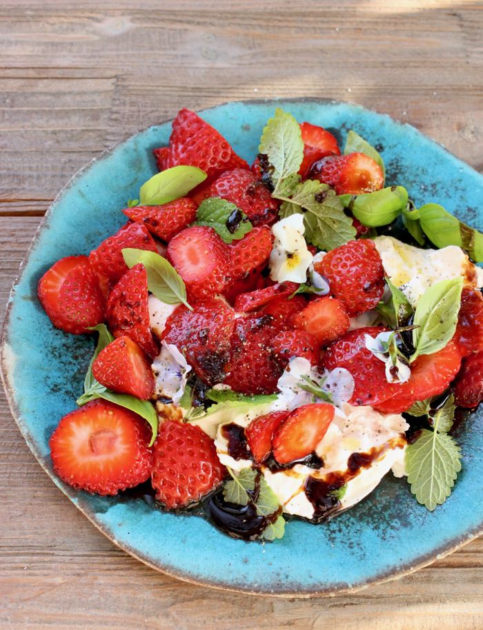 Rustic Blue Plate of Burrata Strawberry Balsamic Salad Drizzled with Homemade Balsamic Glaze Rustic Blue Plate of Burrata Strawberry Balsamic Salad Drizzled with Homemade Balsamic Glaze