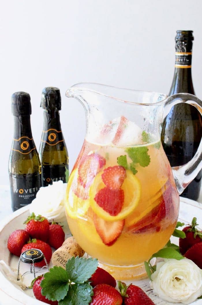 Pitcher of strawberry sangria with oranges and white wine Pitcher of strawberry sangria with oranges and white wine