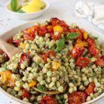 Fregola pasta with pesto and roasted tomatoes