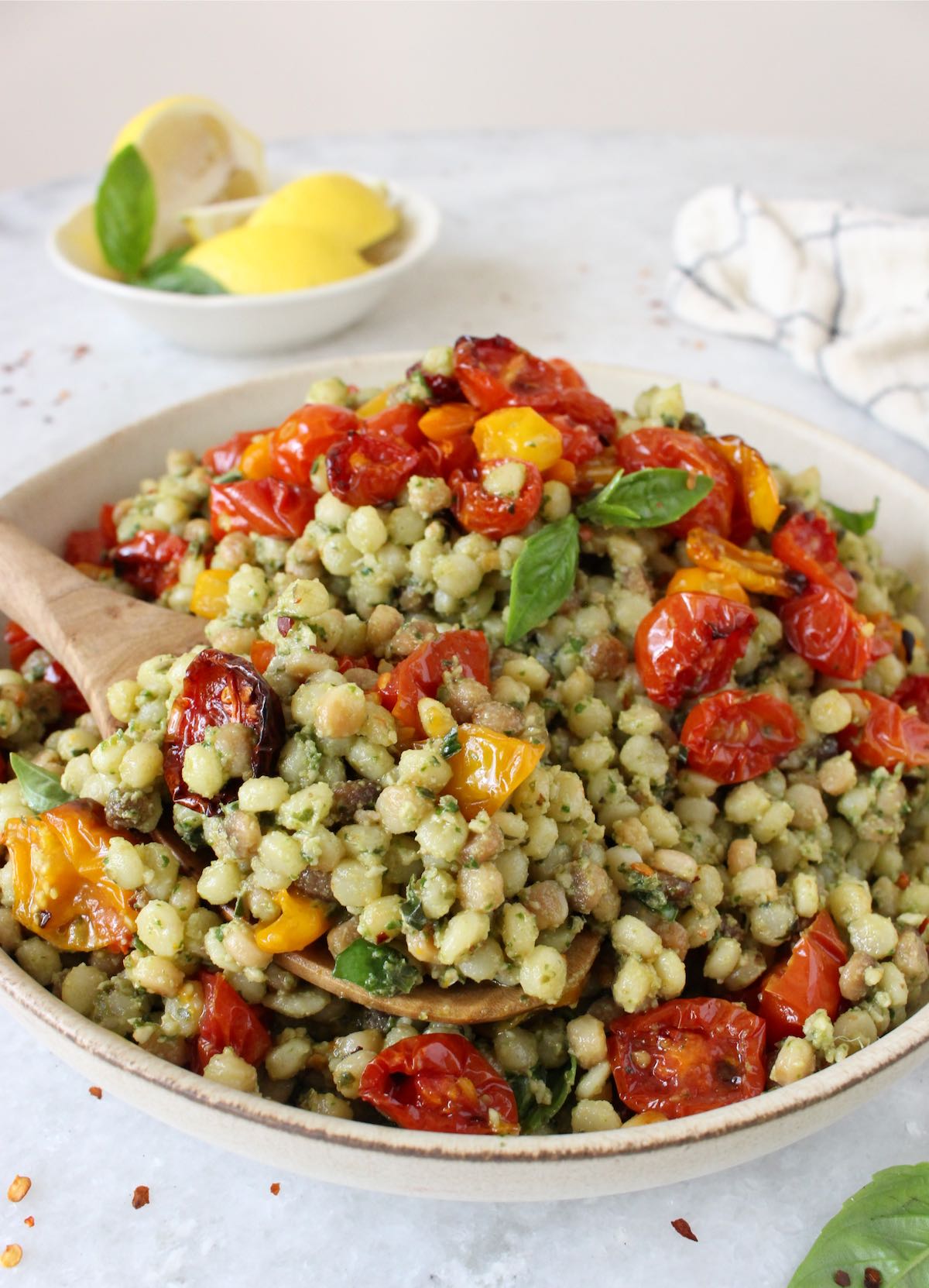 Fregola pasta with pesto and roasted tomatoes
